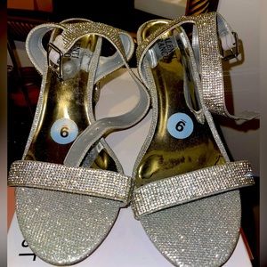 Gorgeous bling heel. Size 9. Worn just to try on dresses for modeling show.